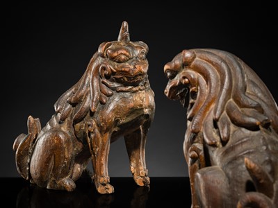 Lot 131 - A PAIR OF POLYCHROME WOOD FIGURES OF KOMA-INU, KAMAKURA PERIOD