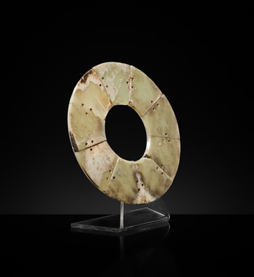 Lot 62 - A LARGE AND COMPLETE CELADON AND RUSSET JADE NINE-SECTION DISK, BI, LATE NEOLITHIC PERIOD-EARLY BRONZE AGE