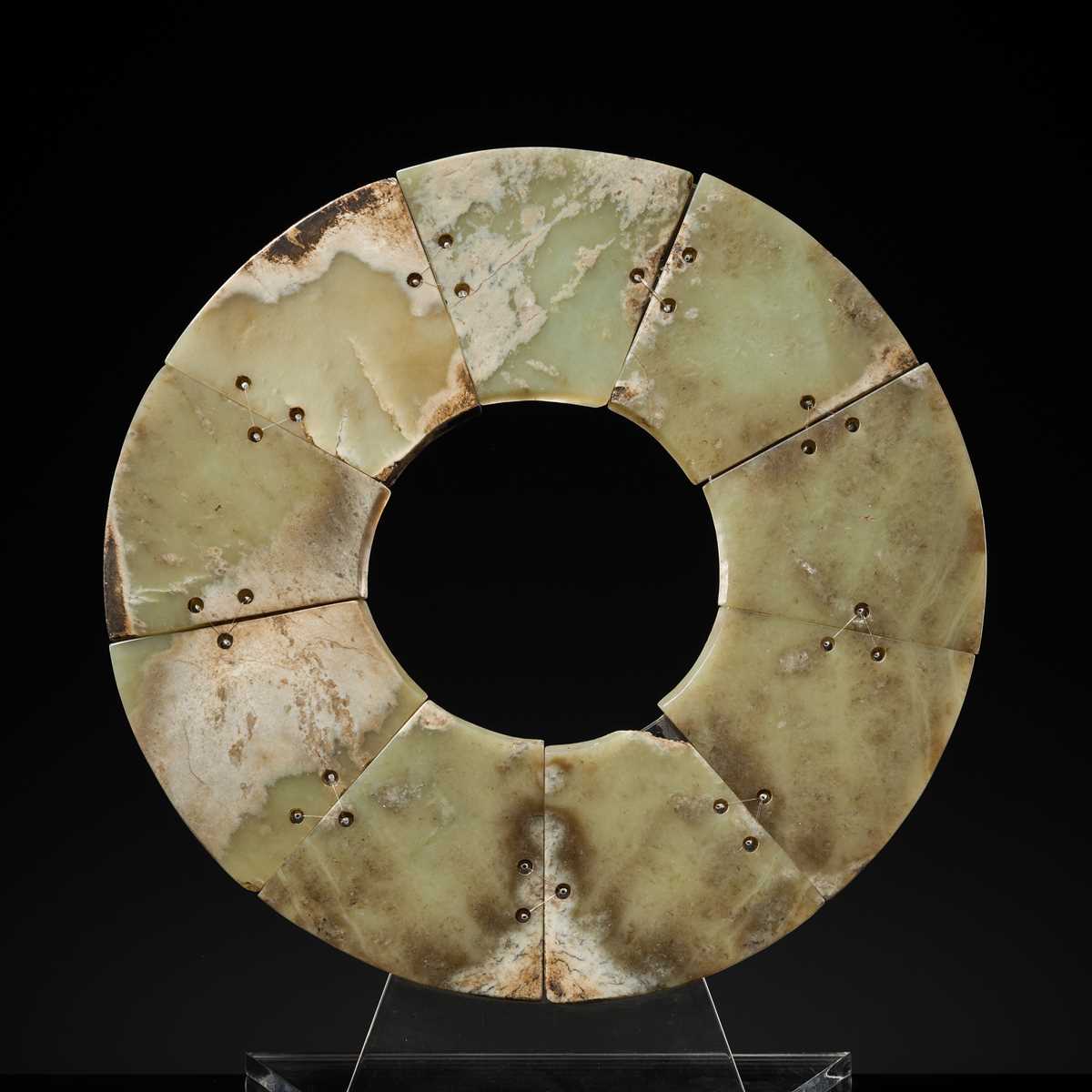 Lot 62 - A LARGE AND COMPLETE CELADON AND RUSSET JADE NINE-SECTION DISK, BI, LATE NEOLITHIC PERIOD-EARLY BRONZE AGE