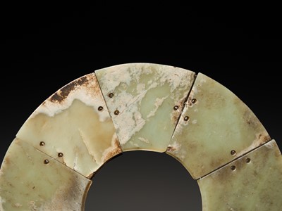 Lot 62 - A LARGE AND COMPLETE CELADON AND RUSSET JADE NINE-SECTION DISK, BI, LATE NEOLITHIC PERIOD-EARLY BRONZE AGE
