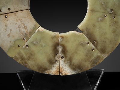 Lot 62 - A LARGE AND COMPLETE CELADON AND RUSSET JADE NINE-SECTION DISK, BI, LATE NEOLITHIC PERIOD-EARLY BRONZE AGE