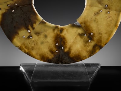 Lot 62 - A LARGE AND COMPLETE CELADON AND RUSSET JADE NINE-SECTION DISK, BI, LATE NEOLITHIC PERIOD-EARLY BRONZE AGE