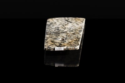Lot 64 - A BLACK AND WHITE ‘STRIPED’ MARBLE AXE, YUE, LATE NEOLITHIC PERIOD-EARLY BRONZE AGE