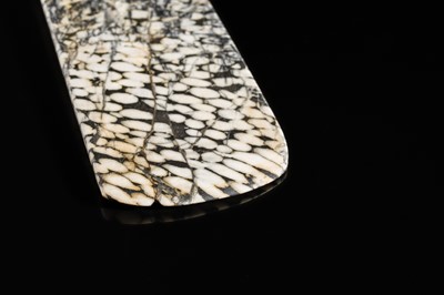 Lot 64 - A BLACK AND WHITE ‘STRIPED’ MARBLE AXE, YUE, LATE NEOLITHIC PERIOD-EARLY BRONZE AGE