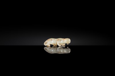 Lot 100 - A SMALL PALE CELADON JADE FIGURE OF A CHILONG, 17TH CENTURY OR EARLIER