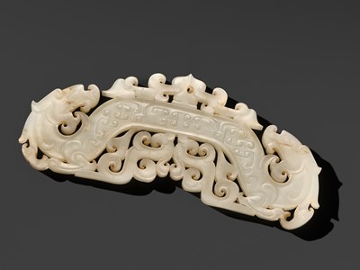 Lot 243 - A WHITE AND RUSSET JADE PENDANT, HUANG, LATE EASTERN ZHOU PERIOD