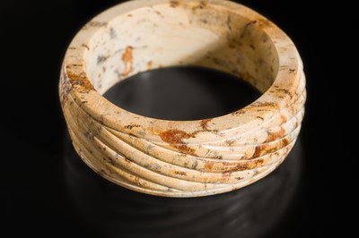 Lot 95 - A YELLOW AND RUSSET JADE ‘ROPE-TWIST’ BANGLE, HAN DYNASTY OR EARLIER