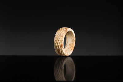 Lot 95 - A YELLOW AND RUSSET JADE ‘ROPE-TWIST’ BANGLE, HAN DYNASTY OR EARLIER