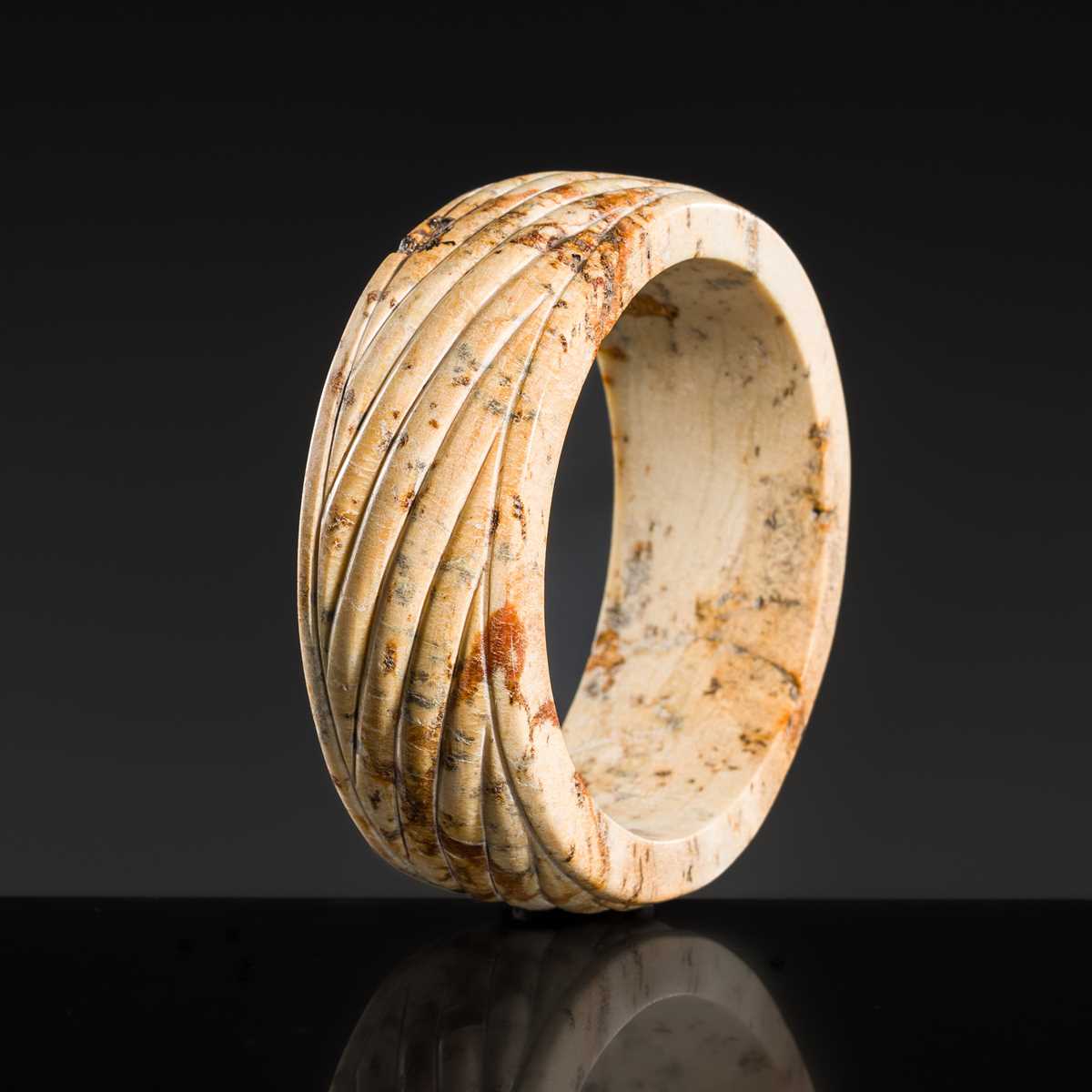 Lot 95 - A YELLOW AND RUSSET JADE ‘ROPE-TWIST’ BANGLE, HAN DYNASTY OR EARLIER