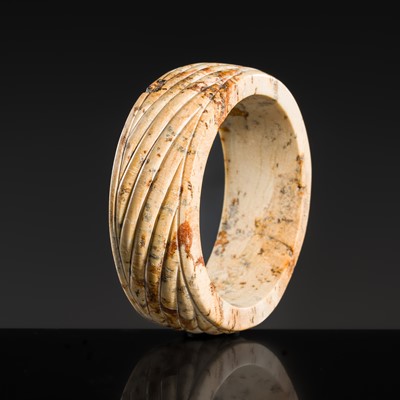 Lot 95 - A YELLOW AND RUSSET JADE ‘ROPE-TWIST’ BANGLE, HAN DYNASTY OR EARLIER