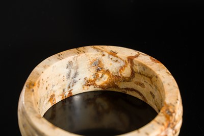 Lot 95 - A YELLOW AND RUSSET JADE ‘ROPE-TWIST’ BANGLE, HAN DYNASTY OR EARLIER