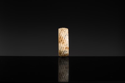 Lot 95 - A YELLOW AND RUSSET JADE ‘ROPE-TWIST’ BANGLE, HAN DYNASTY OR EARLIER