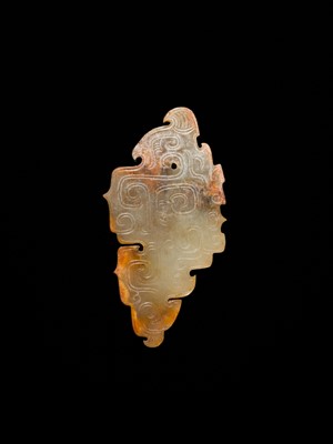 Lot 69 - A PALE YELLOW AND RUSSET JADE ‘BIRD‘ PENDANT, LATE SHANG DYNASTY, ANYANG PHASE