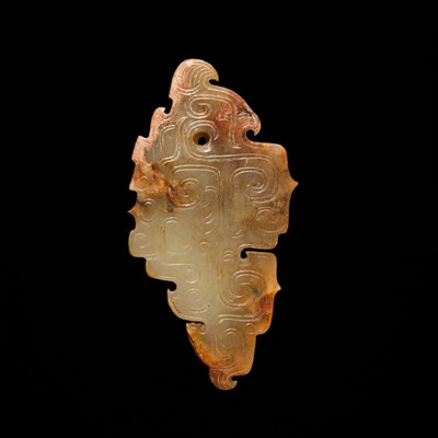 Lot 69 - A PALE YELLOW AND RUSSET JADE ‘BIRD‘ PENDANT, LATE SHANG DYNASTY, ANYANG PHASE