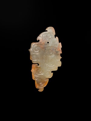 Lot 69 - A PALE YELLOW AND RUSSET JADE ‘BIRD‘ PENDANT, LATE SHANG DYNASTY, ANYANG PHASE