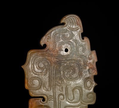 Lot 69 - A PALE YELLOW AND RUSSET JADE ‘BIRD‘ PENDANT, LATE SHANG DYNASTY, ANYANG PHASE