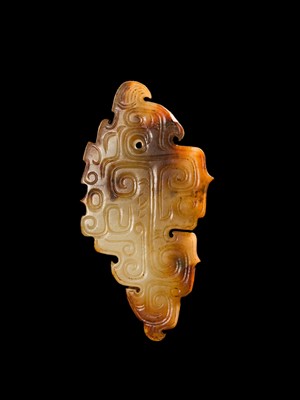 Lot 69 - A PALE YELLOW AND RUSSET JADE ‘BIRD‘ PENDANT, LATE SHANG DYNASTY, ANYANG PHASE