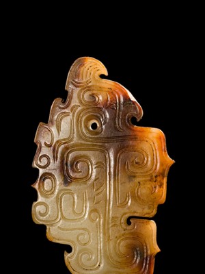 Lot 69 - A PALE YELLOW AND RUSSET JADE ‘BIRD‘ PENDANT, LATE SHANG DYNASTY, ANYANG PHASE