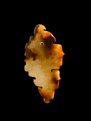 Lot 69 - A PALE YELLOW AND RUSSET JADE ‘BIRD‘ PENDANT, LATE SHANG DYNASTY, ANYANG PHASE