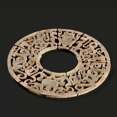 Lot 253 - A WHITE JADE SIX SEGMENTS ‘CHILONG’ OPENWORK DISK (BI), WARRING STATES PERIOD TO EARLY WESTERN HAN DYNASTY