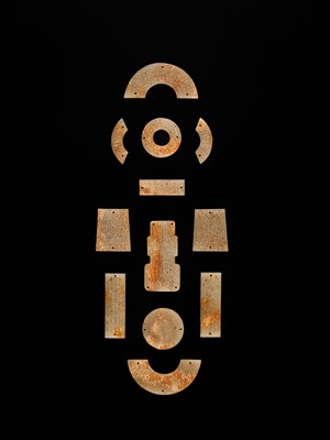 Lot 87 - A SET OF TWELVE WHITE AND RUSSET JADE ORNAMENTS, EASTERN ZHOU DYNASTY