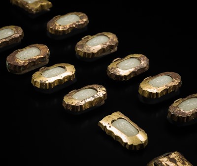Lot 51 - A SET OF FIFTEEN WHITE JADE AND GILT-BRONZE HARNESS ELEMENTS, LIAO DYNASTY