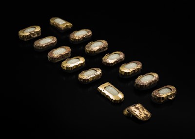 Lot 51 - A SET OF FIFTEEN WHITE JADE AND GILT-BRONZE HARNESS ELEMENTS, LIAO DYNASTY