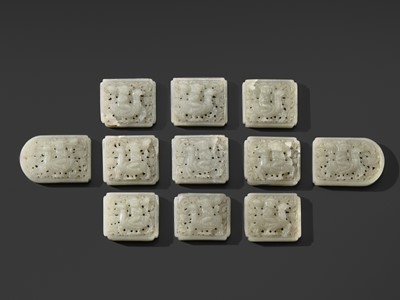 Lot 114 - A RARE SET OF ELEVEN PALE WHITE JADE ‘BOY AND GOOSE’ BELT PLAQUES, LIAO DYNASTY