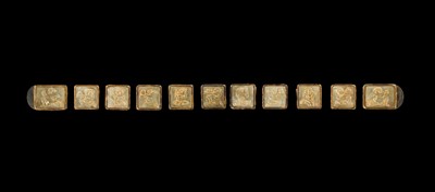 Lot 50 - A SET OF ELEVEN INCISED AND GILT JADE ‘IMMORTAL BANQUET’ BELT PLAQUES WITH GILT SILVER MOUNTS, LIAO DYNASTY