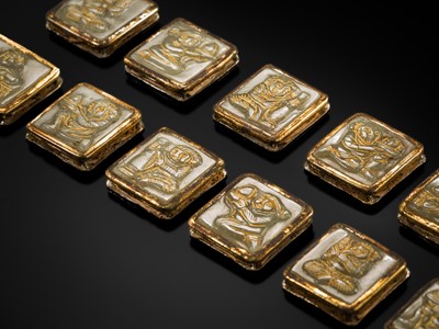 Lot 50 - A SET OF ELEVEN INCISED AND GILT JADE ‘IMMORTAL BANQUET’ BELT PLAQUES WITH GILT SILVER MOUNTS, LIAO DYNASTY