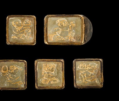 Lot 50 - A SET OF ELEVEN INCISED AND GILT JADE ‘IMMORTAL BANQUET’ BELT PLAQUES WITH GILT SILVER MOUNTS, LIAO DYNASTY