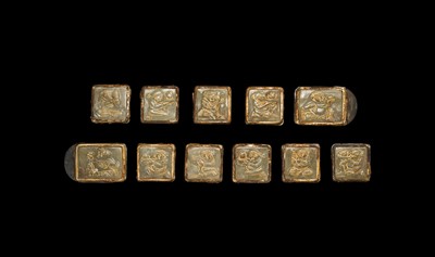 Lot 50 - A SET OF ELEVEN INCISED AND GILT JADE ‘IMMORTAL BANQUET’ BELT PLAQUES WITH GILT SILVER MOUNTS, LIAO DYNASTY