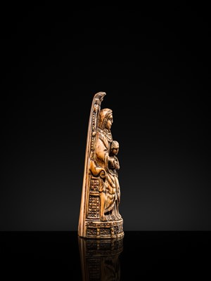 Lot 122 - AN INDO-PORTUGUESE IVORY GROUP DEPICTING SAINT ANNE TEACHING THE VIRGIN TO READ, GOA, LATE 17TH CENTURY