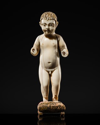 Lot 124 - AN INDO-PORTUGUESE IVORY FIGURE OF THE INFANT CHRIST, GOA, SECOND HALF OF THE 17TH CENTURY