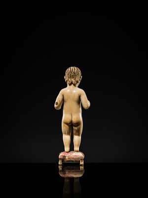 Lot 124 - AN INDO-PORTUGUESE IVORY FIGURE OF THE INFANT CHRIST, GOA, SECOND HALF OF THE 17TH CENTURY