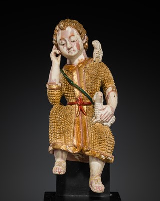 Lot 125 - AN INDO-PORTUGUESE GILT AND POLYCHROME IVORY FIGURE OF CHRIST AS THE GOOD SHEPHERD, GOA, 17TH CENTURY