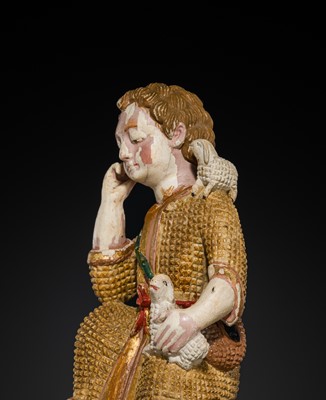 Lot 125 - AN INDO-PORTUGUESE GILT AND POLYCHROME IVORY FIGURE OF CHRIST AS THE GOOD SHEPHERD, GOA, 17TH CENTURY