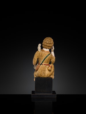 Lot 125 - AN INDO-PORTUGUESE GILT AND POLYCHROME IVORY FIGURE OF CHRIST AS THE GOOD SHEPHERD, GOA, 17TH CENTURY