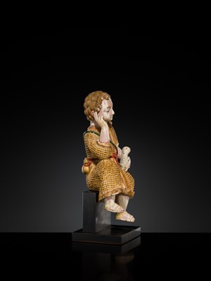 Lot 125 - AN INDO-PORTUGUESE GILT AND POLYCHROME IVORY FIGURE OF CHRIST AS THE GOOD SHEPHERD, GOA, 17TH CENTURY