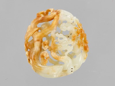 Lot 780 - A CELADON AND RUSSET ‘DRAGON’ JADE PENDANT, LATE QING