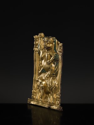 A GILT COPPER REPOUSSÉ ‘LION AND ELEPHANT’ PANEL, TIBET, 17TH-18TH CENTURY