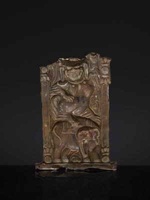 A GILT COPPER REPOUSSÉ ‘LION AND ELEPHANT’ PANEL, TIBET, 17TH-18TH CENTURY