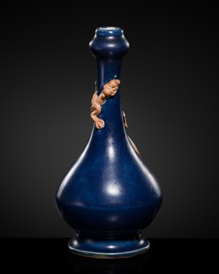 Lot 246 - A BLUE-GLAZED 'GARLIC-MOUTH VASE WITH A DRAGON, LATE MING DYNASTY