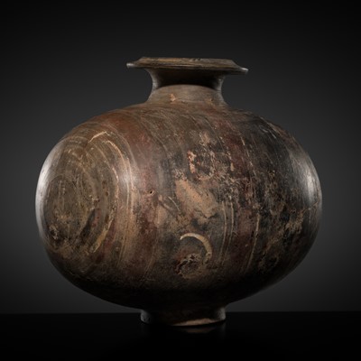 Lot 186 - AN ABSTRACTLY PAINTED POTTERY COCOON JAR, HAN DYNASTY