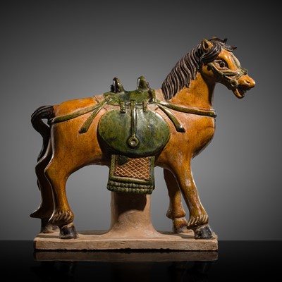 Lot 255 - A MING DYNASTY STYLE SANCAI GLAZED POTTERY FIGURE OF A HORSE