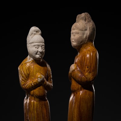 Lot 200 - A PAIR OF AMBER-GLAZED POTTERY FIGURES OF OFFICIALS, TANG DYNASTY