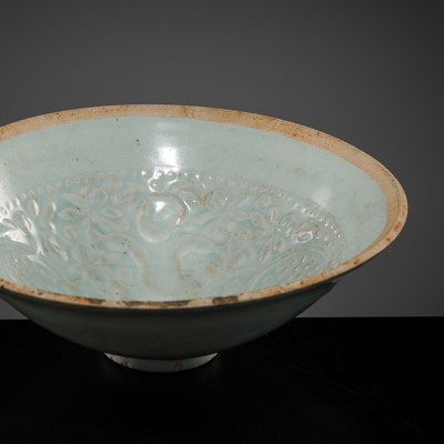 Lot 217 - A CARVED QINGBAI ‘BOYS AND LOTUS’ BOWL, SOUTHERN SONG DYNASTY