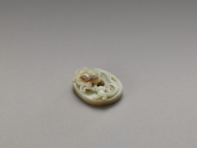 Lot 775 - A CELADON AND RUSSET ‘CHILONG AND PHEONIX’ JADE DISC, LATE QING