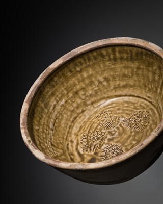 Lot 209 - A RARE AND LARGE BROWN GLAZED ‘PEONY’ BASIN, SONG DYNASTY