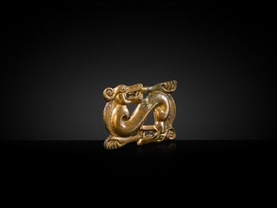 Lot 88 - A GILT-BRONZE ‘WOLF’ OPENWORK PLAQUE, NORTHWEST CHINA, 3RD-1ST CENTURY BC